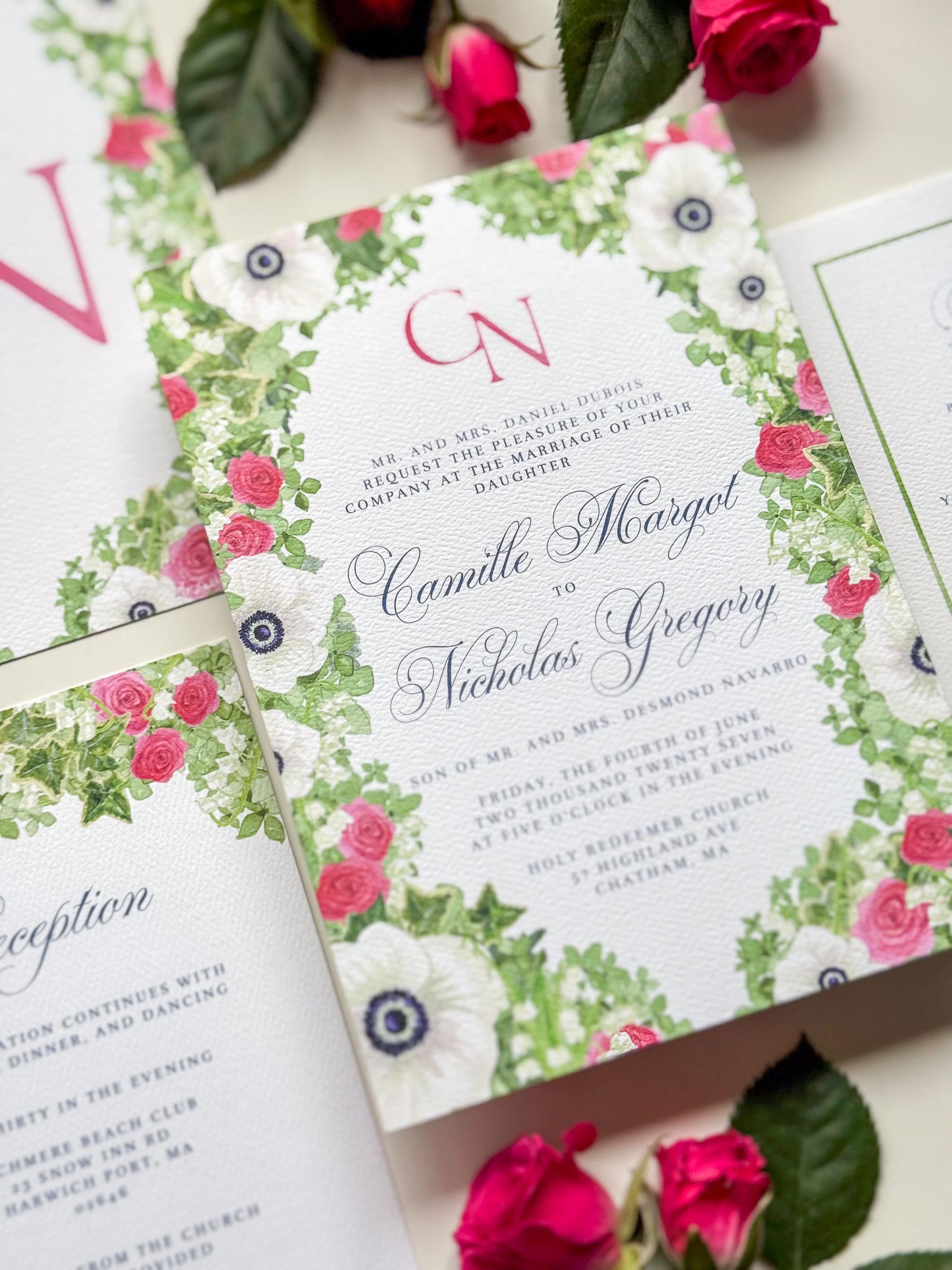 Wedding invitation with rose-pink “N” monogram and pink-green watercolor floral border