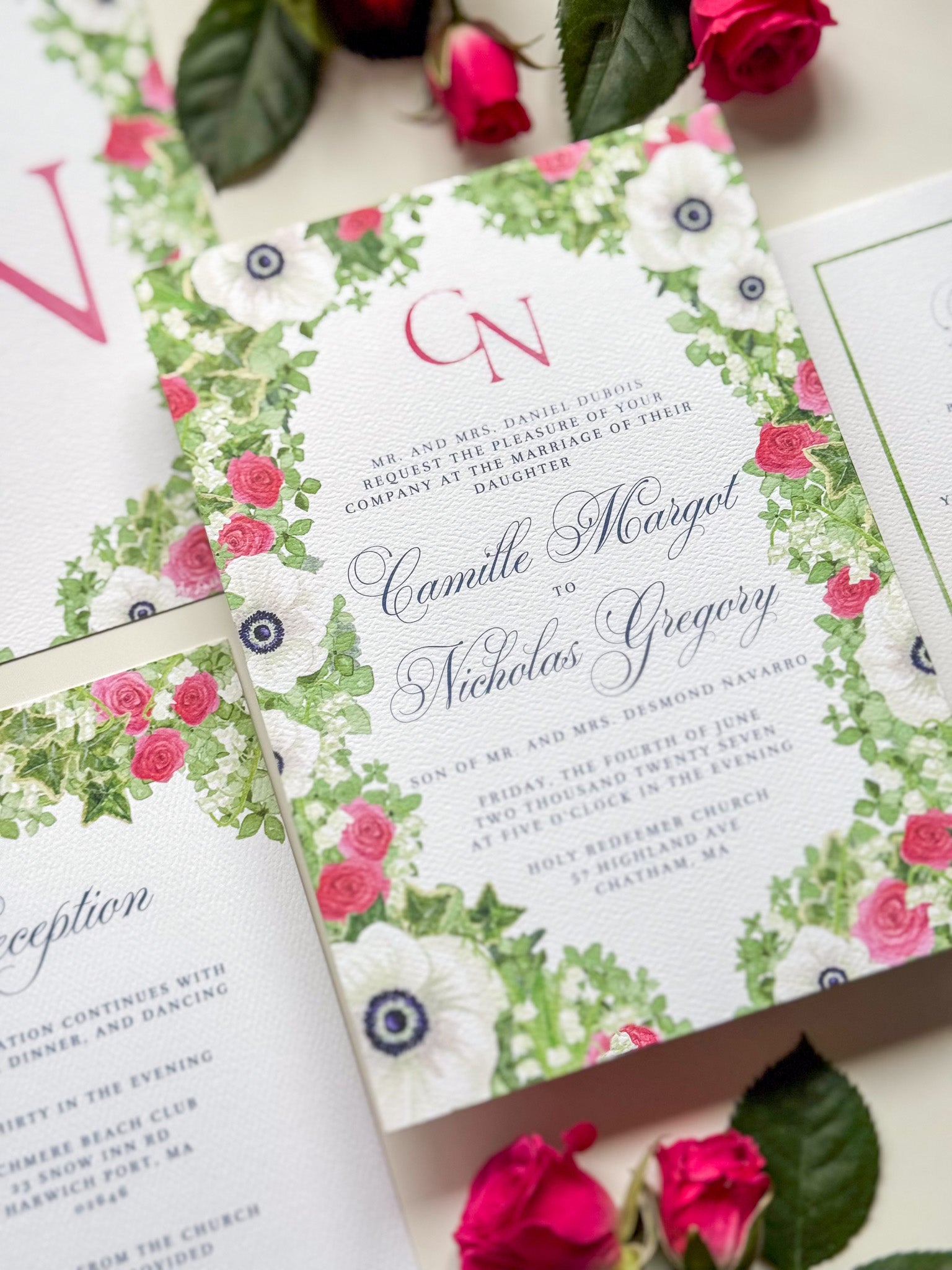Wedding invitation with rose-pink “N” monogram and pink-green watercolor floral border