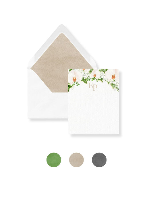 White stationery envelope set with floral monogram Kp and green liner swatch