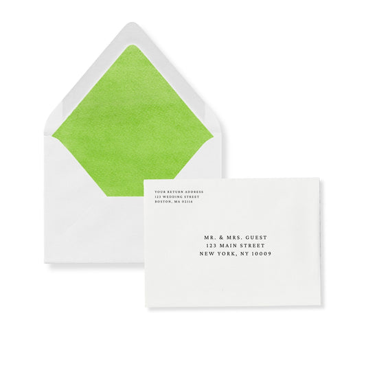 European flap invitation envelope with palm green liner and guest address text