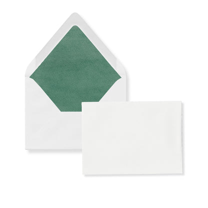 Luxe invitation envelope with green liner and flap; card in front shows blank white space