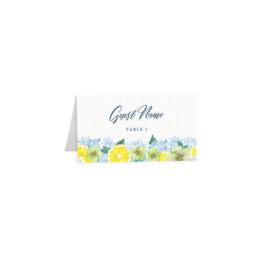 Tented card: script “Guest Name” in navy blue, lemon & hydrangea border