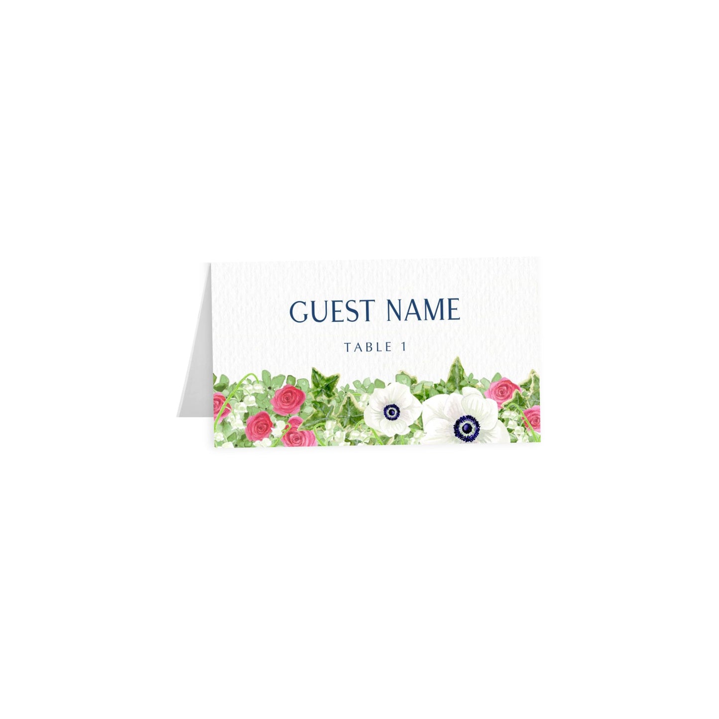 White tented escort card with floral anemone border, blue uppercase “GUEST NAME” — Table 1