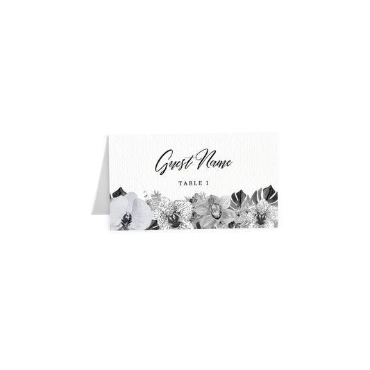 Tented escort card: black cursive Guest Name, Table 1 over black/white tropical florals