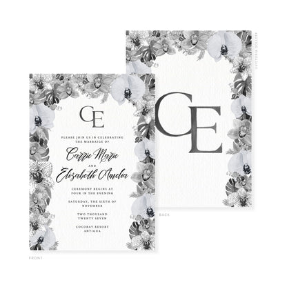 Wedding invitation with dark charcoal monogram, floral border, and couple names