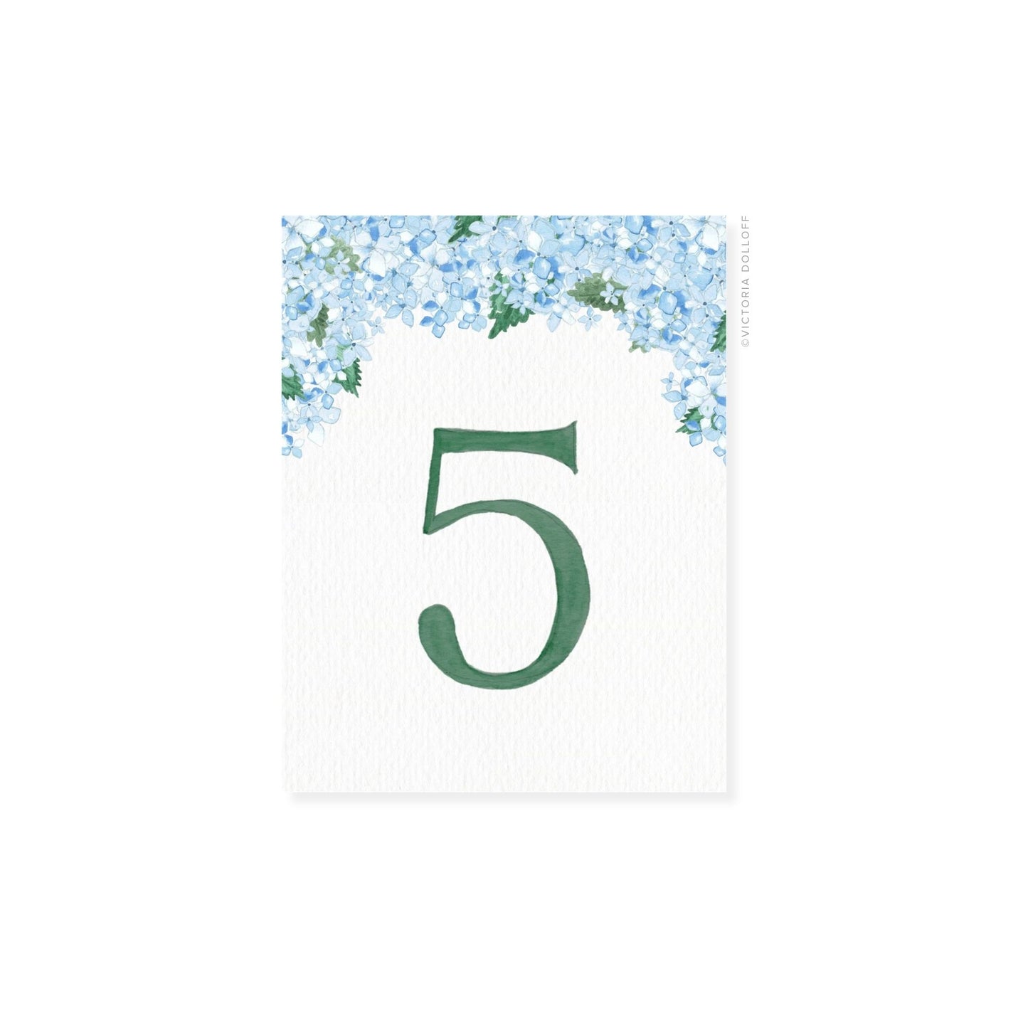 Table number 5 in emerald green with blue floral border and greenery arch