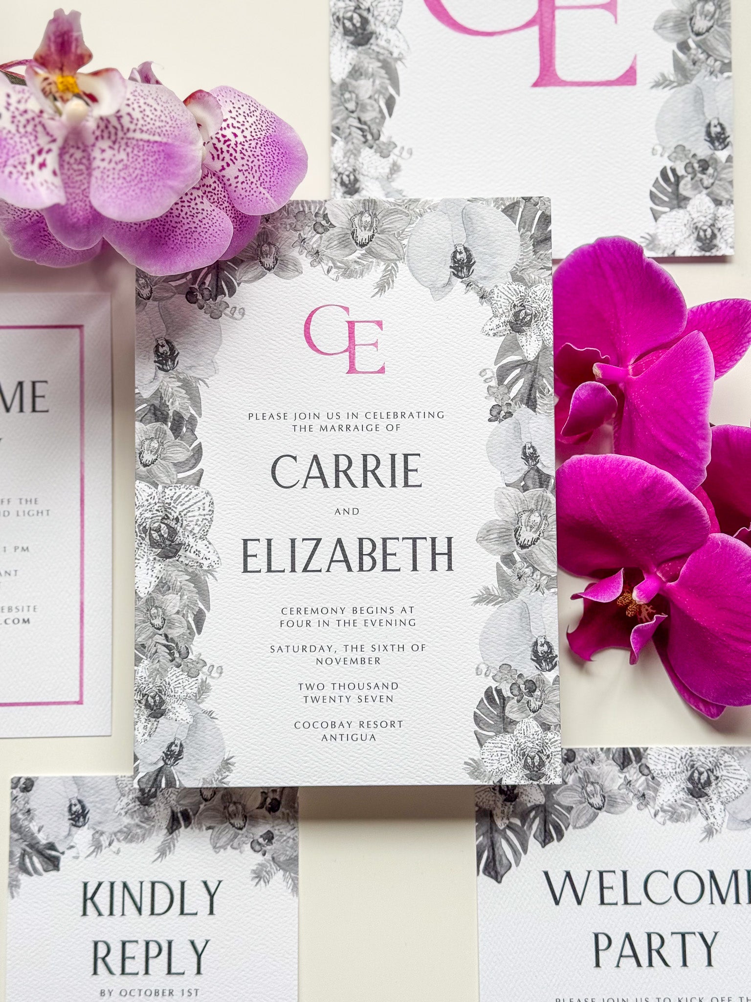 Floral wedding invitation with magenta monogram E, Carrie & Elizabeth and event date text