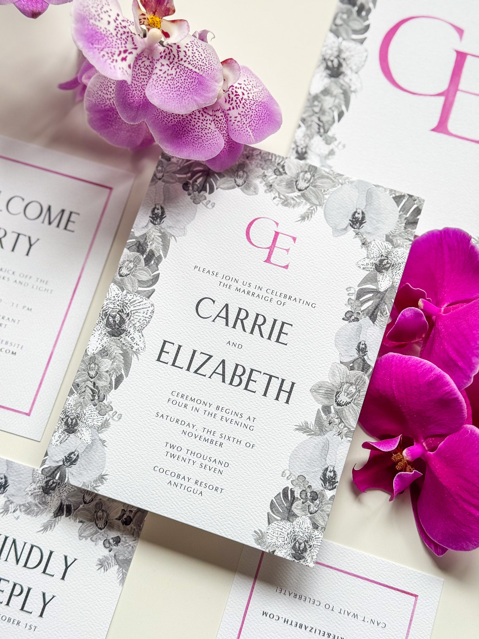 Carrie Collection watercolor wedding invitation with magenta monogram and floral border